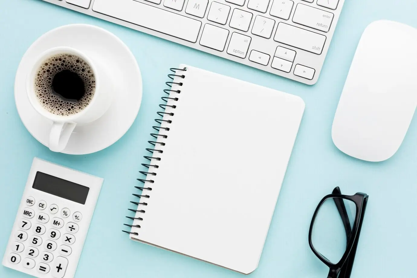 Conceptual desk arrangement with a notebook.